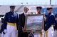 The U.S. Air Force Academy's Class of 2016 presents President Barack Obama with a painting of the Academy June 2, 2016, after his commencement speech to the graduating class at Falcon Stadium. (U.S. Air Force photo/Bill Evans)