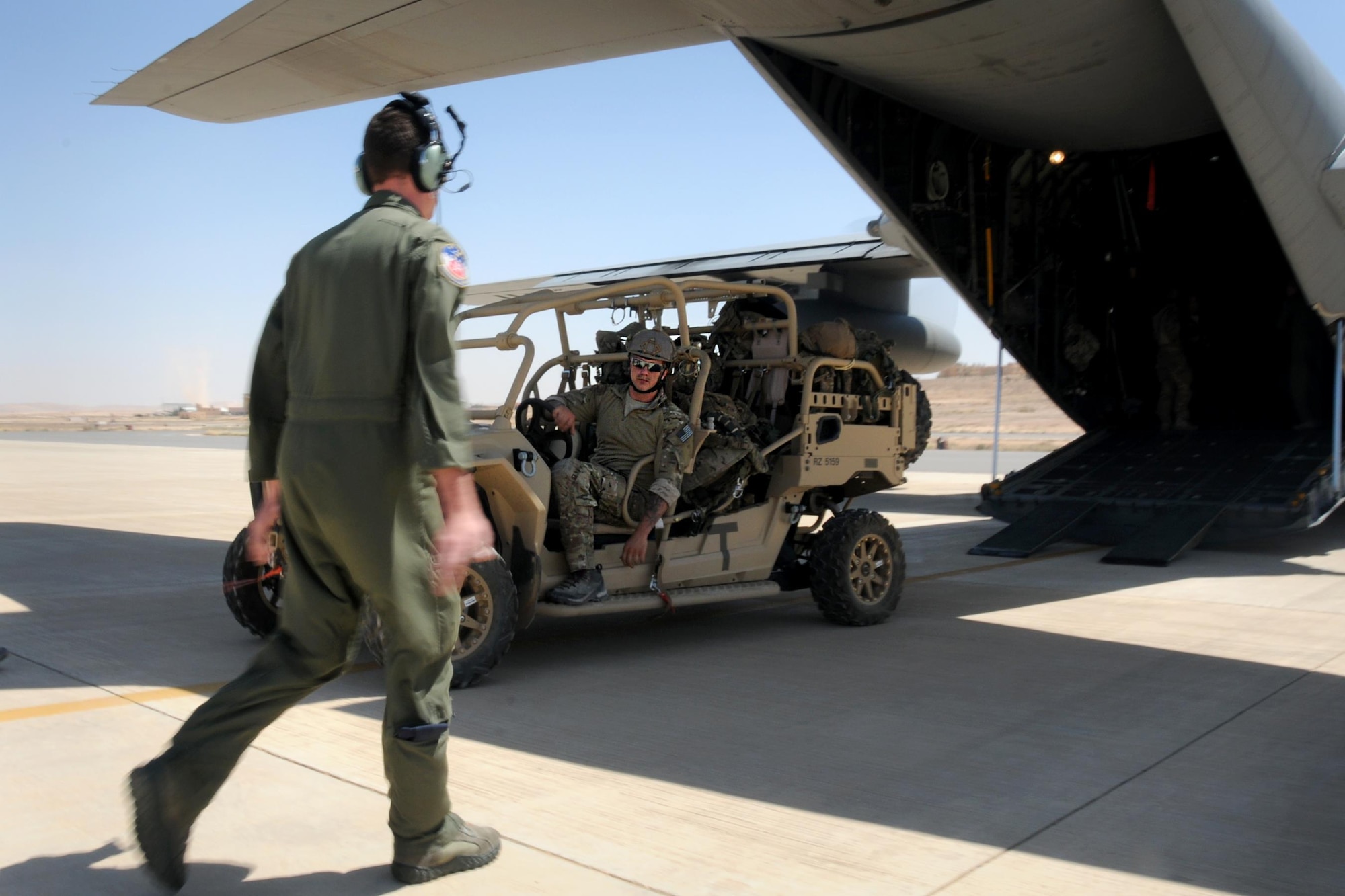Senior Airman Dylan Gann, 700th Airlift Squadron loadmaster, directs a Special Tactics Airman and his tactical vehicle into the back of a 94th Airlift Wing C-130 during Exercise Eager Lion in Jordan, 20 May, 2016. Special Tactics Airmen, the Air Force’s ground special operations force, use vehicles like this to establish air fields after jumping to infiltrate hostile or austere territory. (U.S. Air Force photo/Staff Sgt. Alan Abernethy)
