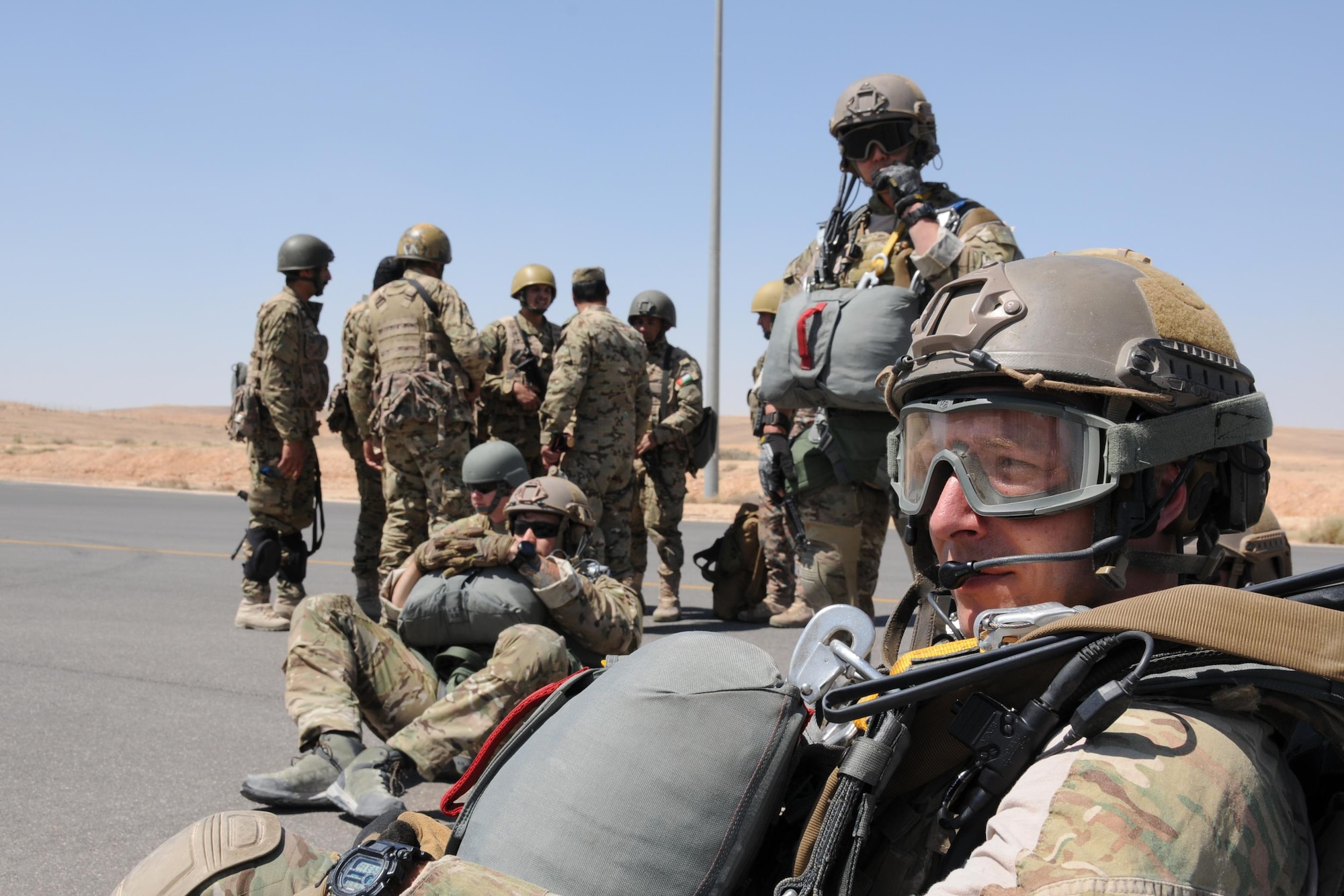 Special Tactics Airmen and Royal Jordanian Armed Forces paratroopers wait to board a 94th Airlift Wing C-130 for an airdrop mission supporting Exercise Eager Lion in Jordan, May 19, 2016. Special Tactics Airmen, the Air Force’s ground special operations force, establish air fields and drop zone for follow-on forces after freefalling in to infiltrate into hostile or austere territory. (U.S. Air Force photo/Staff Sgt. Alan Abernethy)
