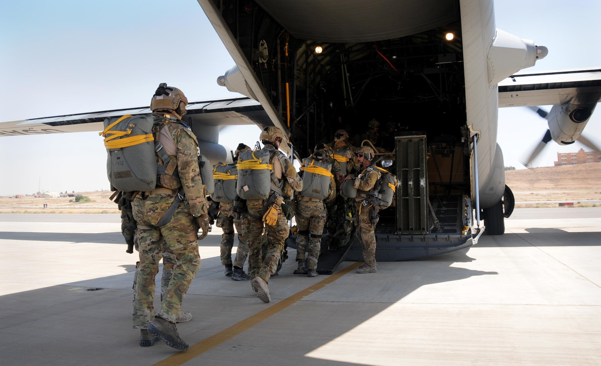 Special Tactics Airmen board a 94th Airlift Wing C-130 for an airdrop mission supporting Exercise Eager Lion in Jordan, May 19, 2016. Special Tactics Airmen jump low-level static line jumps to infiltrate into hostile or austere territory where aircraft cannot land. (U.S. Air Force photo/Staff Sgt. Alan Abernethy)
