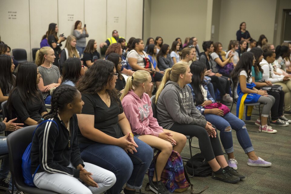 Middle school students participating in the Classroom to Career Day, listen to Marines and sailors explain various jobs in the service aboard Marine Corps Air Ground Combat Center, Twentynine Palms, Calif. May 26, 2016. Communication Training Battalion and the Girl Scouts organized the event to enable youth professional development and foster community relationships.  (Official Marine Corps photo by Cpl. Connor Hancock/Released)