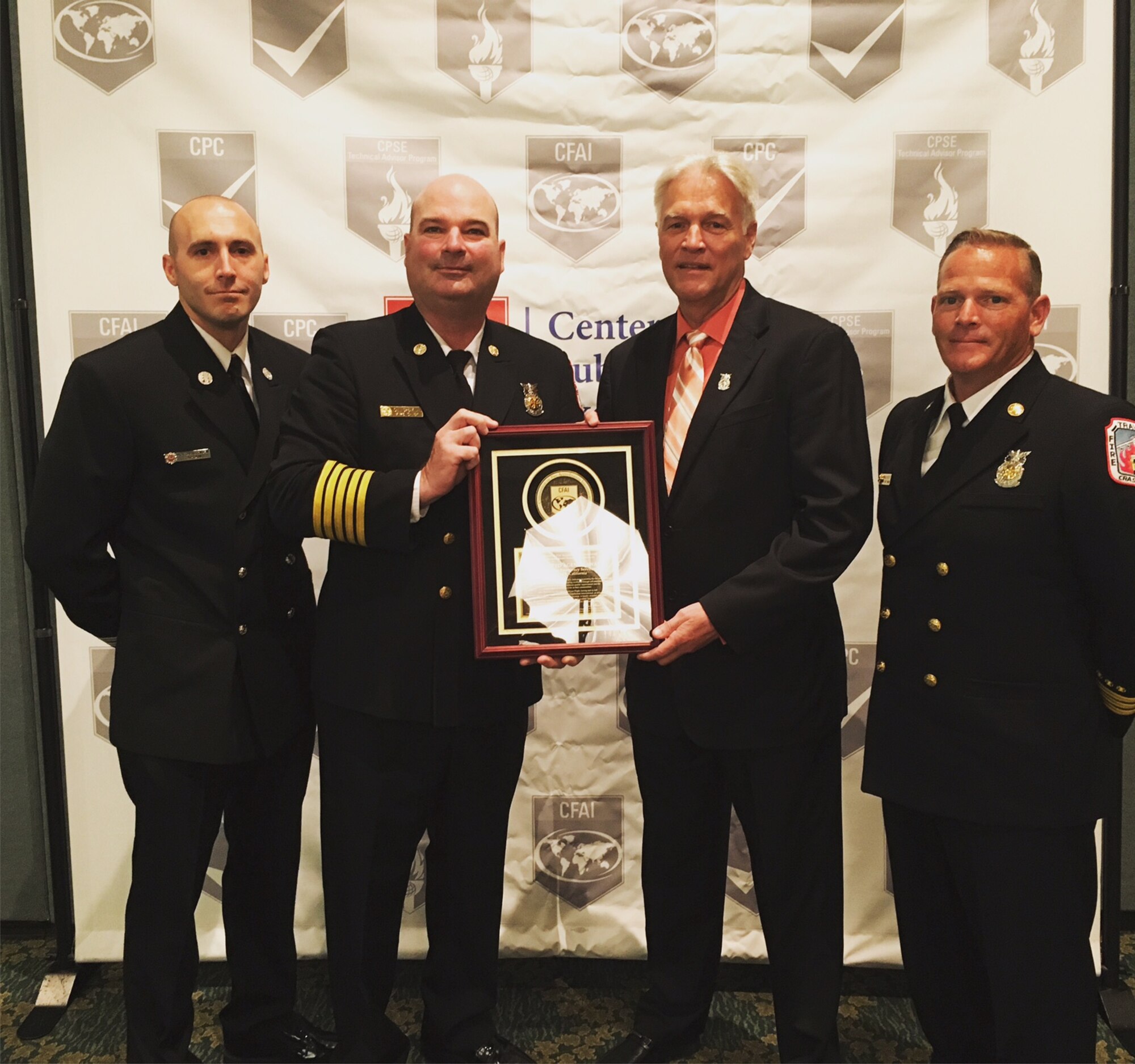 (From left to right) Capt. Nick Christensen, 60th Civil Engineer Squadron fire emergency services captain and assistant accreditation manager, John Speakman, fire chief, Jim Podolske, Air Force fire chief, and Don Richert, assistant fire chief and accreditation manager, pose for a photo March 17, 2016, in Orlando, Florida. Travis Fire Emergency Services received Accredited Agency Status by the Commission on Fire Accreditation International at the Center for Public Safety Excellence hearings in Orlando. (Courtesy photo)
