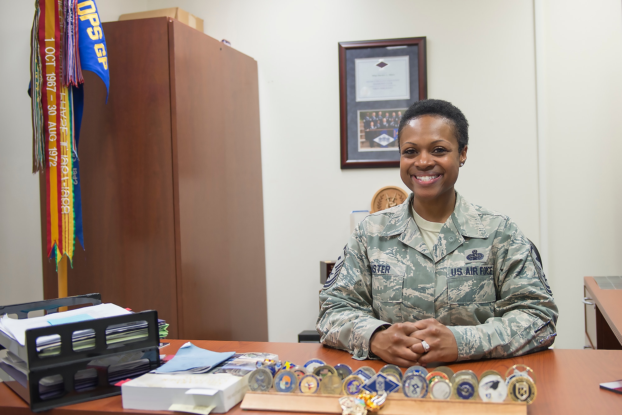 Master Sgt. Dierdre Mister, 36th Airlift Squadron first sergeant, poses for a photo at Yokota Air Base, Japan, May 17, 2016. As a first sergeant, Mister works to ensure that her commander has a mission-ready force by maintaining unit morale, health and welfare. (U.S. Air Force photo by Senior Airman David C. Danford/Released)