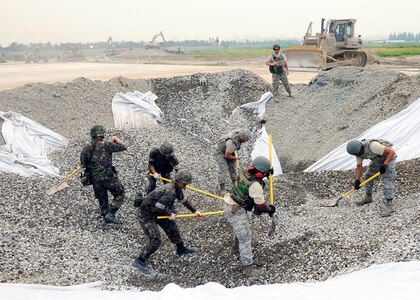 GWANGJU AIR BASE, Republic of Korea (June 1, 2016) - Airmen assigned to Pacific Air Forces bases excavate and refill a crater on the airfield during an Airfield Damage Repair bilateral training scenario.  The training is part of Pacific Unity, a bilateral training exercise designed to enhance interoperability and build partnership capacity in the Indo-Asia Pacific region.  