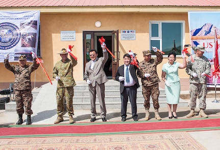 ULAANBAATAR, Mongolia (June 02, 2016) – Multinational military leaders and Mongolian civilian officials cut the ceremonial ribbon, officially opening the 4th School Dormitory at the ribbon-cutting ceremony commemorating the completion of the project that was built as part of an Engineering Civic Action Program during Khaan Quest 2016, in the city of Zuunmod, Mongolia. The dormitory was built by Mongolian soldiers and construction workers; U.S. Marines from the 9th Engineer Support Battalion; U.S. Soldiers from the 411th Engineer Battalion; U.S. Sailors attached to Naval Mobile Construction Battalion (NMCB) 4; service members from the Singapore Armed Forces; and service members from the Indian Armed Forces. Khaan Quest 2016 is an annual, multinational peacekeeping operations exercise hosted by the Mongolian Armed Forces, co-sponsored by U.S. Pacific Command, and supported by U.S. Army Pacific and U.S. Marine Corps Forces, Pacific. Khaan Quest, in its 14th iteration, is the capstone exercise for this year’s Global Peace Operations Initiative program. The exercise focuses on training activities to enhance international interoperability, develop peacekeeping capabilities, build to mil-to-mil relationships, and enhance military readiness. 