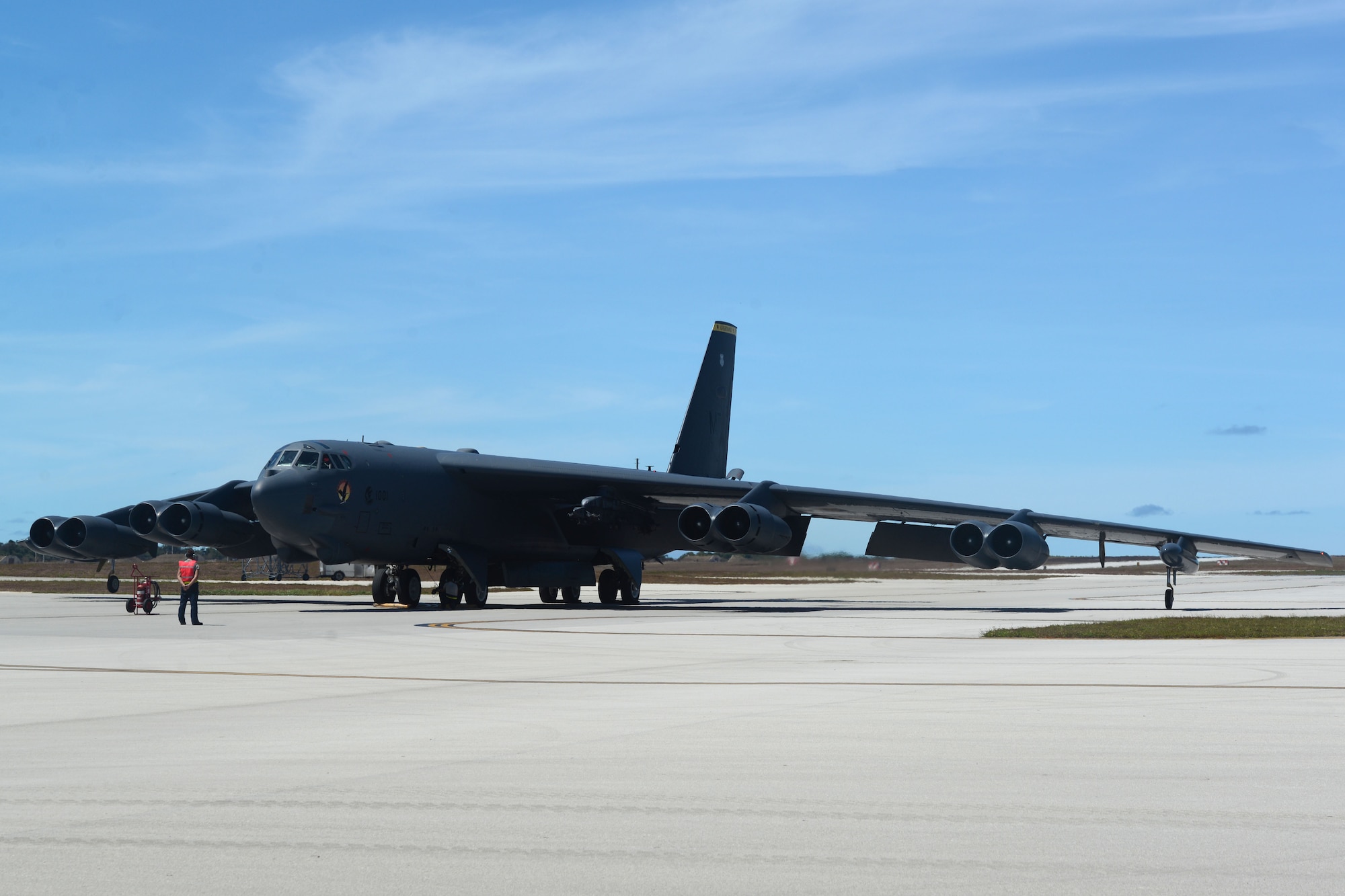 A B-52 Stratofortress from Minot Air Force Base, ND, is marshalled in June 2, 2016, at Andersen Air Force Base, Guam. The aircraft and crew are deployed in support of the Continuous Bomber Presence, which is designed to demonstrate U.S. commitment to the Indo-Asia-Pacific region and enhance regional security. (U.S. Air Force photo by Airman 1st Class Alexa Ann Henderson/Released)