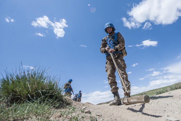 160601-N-WI365-075 ULAANBAATAR, Mongolia (June 01, 2016) – A soldier with the Mongolian Armed Forces inspects for land mines during a mine clearance and counter-improvised explosive device training course at Five Hills Training Area, Mongolia. The 10-day course is part of Khaan Quest 2016 and is designed to increase MAF soldiers' capability in detecting unexploded ordnance and mine awareness skills that can be used during deployments or peacekeeping missions. Khaan Quest 2016 is an annual, multinational peacekeeping operations exercise hosted by the Mongolian Armed Forces, co-sponsored by U.S. Pacific Command, and supported by U.S. Army Pacific and U.S. Marine Corps Forces, Pacific. Khaan Quest, in its 14th iteration, is the capstone exercise for this year’s Global Peace Operations Initiative program. The exercise focuses on training activities to enhance international interoperability, develop peacekeeping capabilities, build mil-to-mil relationships, and enhance military readiness. (U.S. Navy photo by Mass Communication Specialist 3rd Class Markus Castaneda/RELEASED)