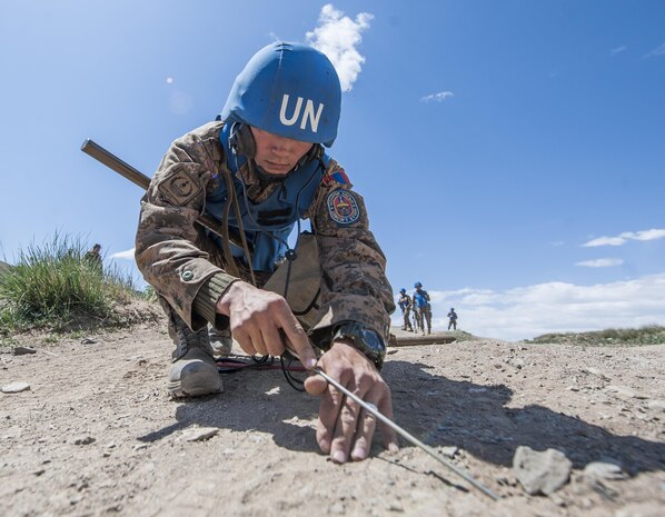 160601-N-WI365-075 ULAANBAATAR, Mongolia (June 01, 2016) – A soldier with the Mongolian Armed Forces marks an area after inspecting for land mines during a counter-improvised explosive device training course at Five Hills Training Area, Mongolia. The 10-day course is part of Khaan Quest 2016 and is designed to increase MAF soldiers' capability in detecting unexploded ordnance and mine awareness skills that can be used during deployments or peacekeeping missions. Khaan Quest 2016 is an annual, multinational peacekeeping operations exercise hosted by the Mongolian Armed Forces, co-sponsored by U.S. Pacific Command, and supported by U.S. Army Pacific and U.S. Marine Corps Forces, Pacific. Khaan Quest, in its 14th iteration, is the capstone exercise for this year’s Global Peace Operations Initiative program. The exercise focuses on training activities to enhance international interoperability, develop peacekeeping capabilities, build mil-to-mil relationships, and enhance military readiness. (U.S. Navy photo by Mass Communication Specialist 3rd Class Markus Castaneda/RELEASED)