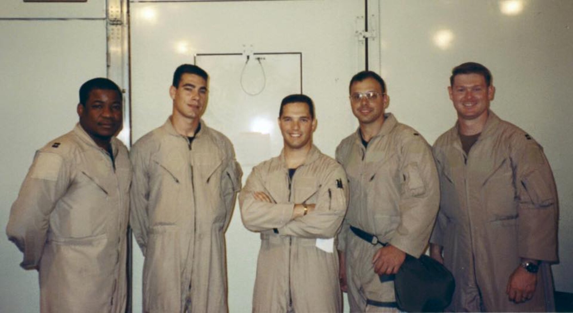Then 1st Lt. Joey Markusfeld, center, KC-135 Stratotanker copilot, poses for a photo with the rest of his crew, October 2001, during a deployment in support of the war on terrorism. Markusfeld was part of one of five aircrews to deploy from McConnell Air Force Base, Kan., in the month following the 9/11 attacks.  (Courtesy photo)