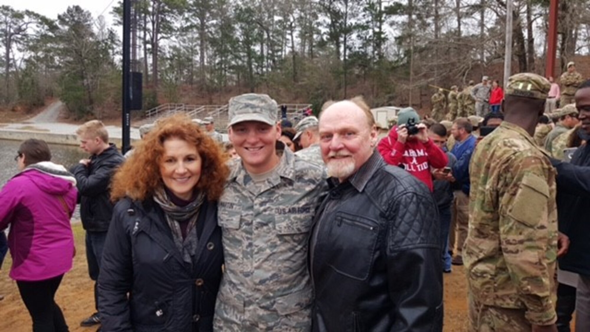 U.S. Air Force Senior Airman Maxwell Martin, reaction force leader assigned to the 633rd Security Forces Squadron, embraces his parents after graduating Ranger School at Fort Benning, Ga., March 4, 2016. Martin was the only Airman to graduate in his class. (Courtesy Photo)