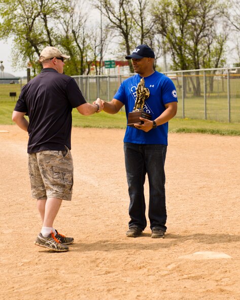 Team Minot faced-off against Team Grand Forks in the 2nd annual Wingman Week softball tournament in Devil’s Lake, N.D., May 20, 2016. Wingman week is intended to help Airmen recharge and to reframe the Wingman concept. Grand Forks won the final game, becoming this year’s softball tournament champions. (U.S. Air Force photo/Airman 1st Class J.T. Armstrong) 