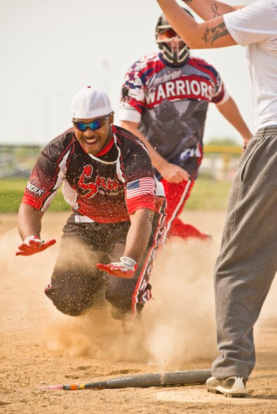 Team Minot faced-off against Team Grand Forks in the 2nd annual Wingman Week softball tournament in Devil’s Lake, N.D., May 20, 2016. Wingman week is intended to help Airmen recharge and to reframe the Wingman concept. Grand Forks won the final game, becoming this year’s softball tournament champions. (U.S. Air Force photo/Airman 1st Class J.T. Armstrong) 