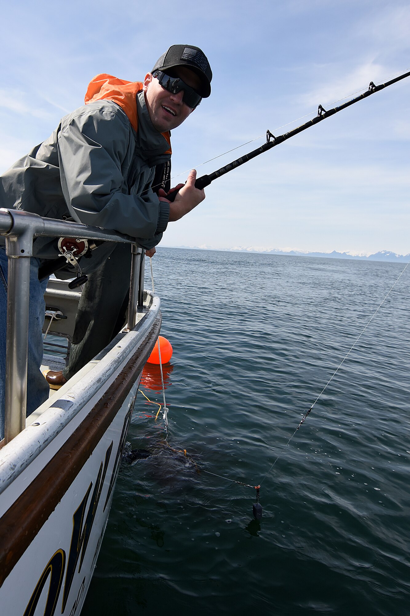 Air Force Staff Sgt. Devin Leabo takes a breather after fighting a 98-pound halibut to the surface in the 10th Annual Armed Services Combat Fishing Tournament May 26. The tournament, hosted by the city of Seward and the Armed Services YMCA, gave more than 200 military anglers stationed in Alaska a free day of halibut fishing to thank them for their service. (U.S. Army photo by John Pennell)