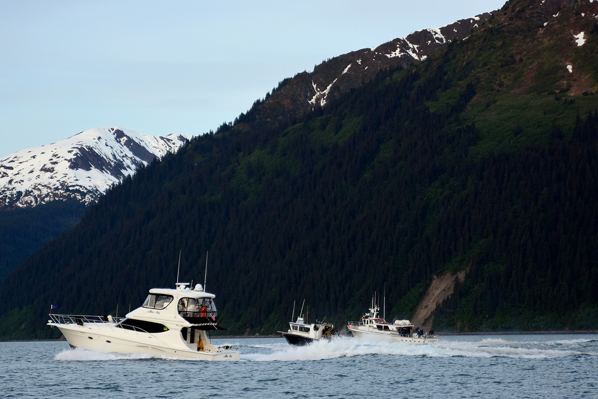 A variety of volunteer fishing charter boats head out into Resurrection Bay from Seward, Alaska, May 26 with service members taking part in the 10th Annual Armed Services Combat Fishing Tournament. The tournament, hosted by the city and the Armed Services YMCA, gave more than 200 military anglers stationed in Alaska a free day of halibut fishing to thank them for their service. (U.S. Army photo by John Pennell)