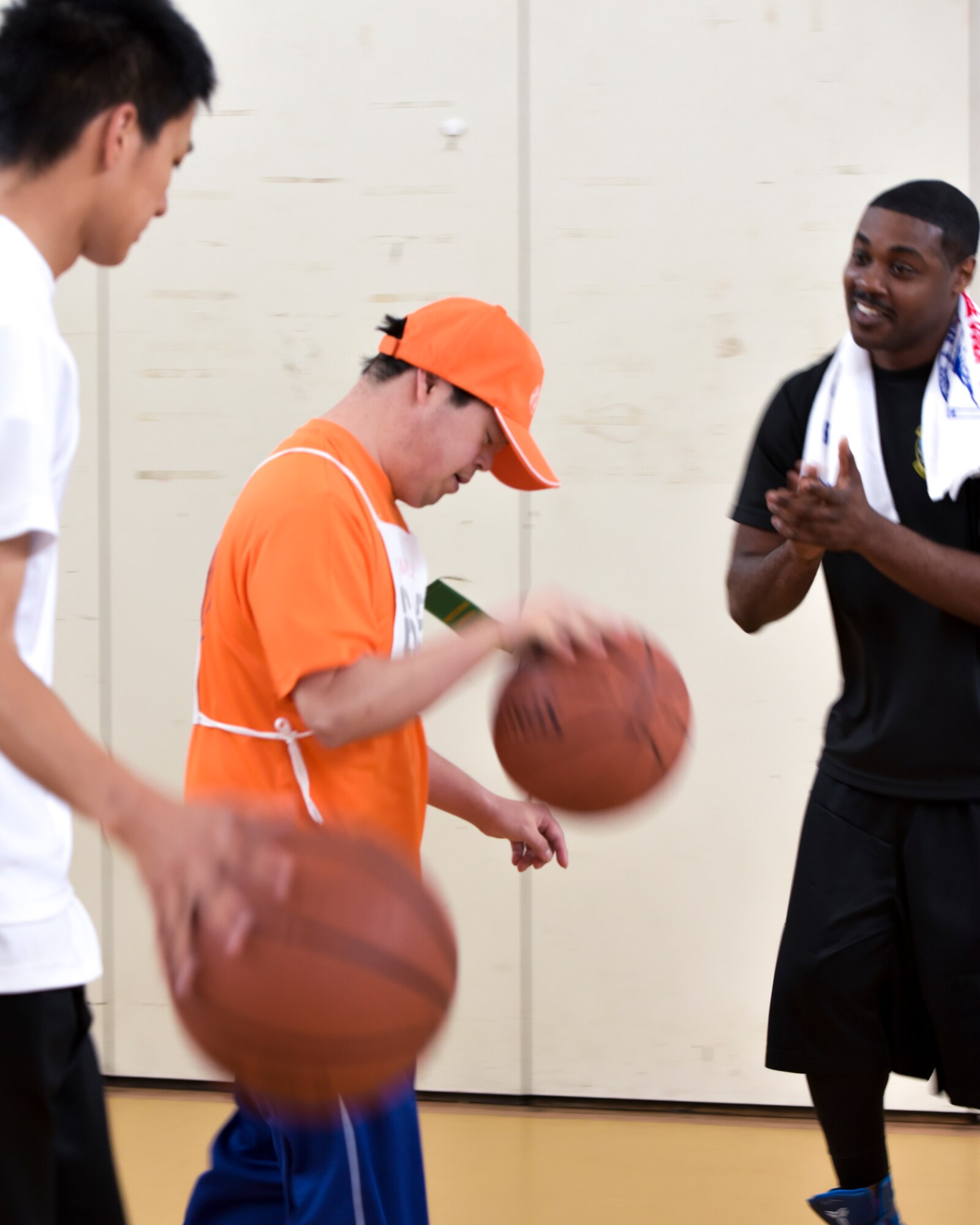 An athlete dribbles a ball during the basketball event at the 37th Annual Kanto Plains Special Olympics at Yokota Air Base, Japan, May 28, 2016. The KPSO provided an opportunity for competitors to have fun and build friendships.  (U.S. Air Force photo by Machiko Imai/Released)