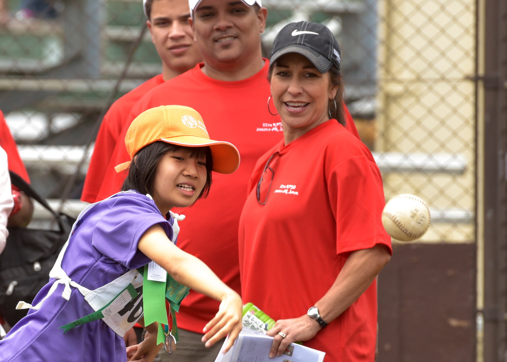 An athlete throws a softball during the 37th Annual Kanto Plains Special Olympics at Yokota Air Base, Japan, May 28, 2016. Approximately 140 athletes, consisting of nine schools throughout the Kanto Plains, competed in events ranging from the bowling and swimming to track and field. More than 1000 volunteers from U.S. military installations in the area, as well as members of the Japanese Self-Defense Force and volunteers from surrounding communities, also took part in the event. (U.S. Air Force photo by Machiko Imai/Released)