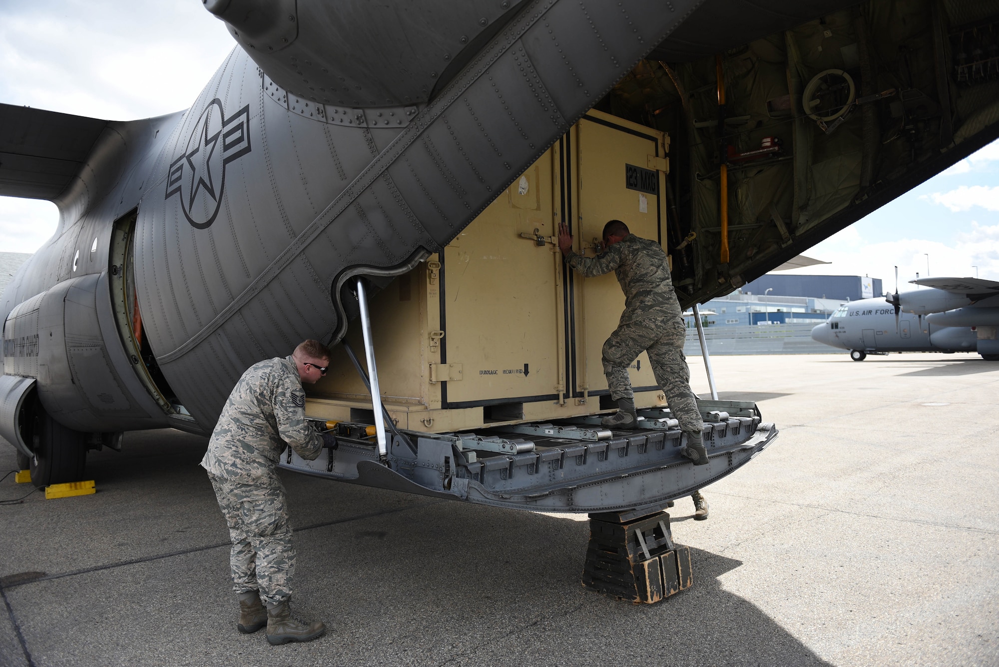 Airmen from the 123rd Airlift Wing unload cargo from a Kentucky Air National Guard C-130 aircraft upon arriving in Edmonton, Canada, May 28, 2016. More than 30 Airmen from the Kentucky Air National Guard are currently deployed here to participate in Maple Flag, an aerial combat training exercise involving forces from multiple countries. (U.S. Air National Guard photo by Senior Airman Joshua Horton)