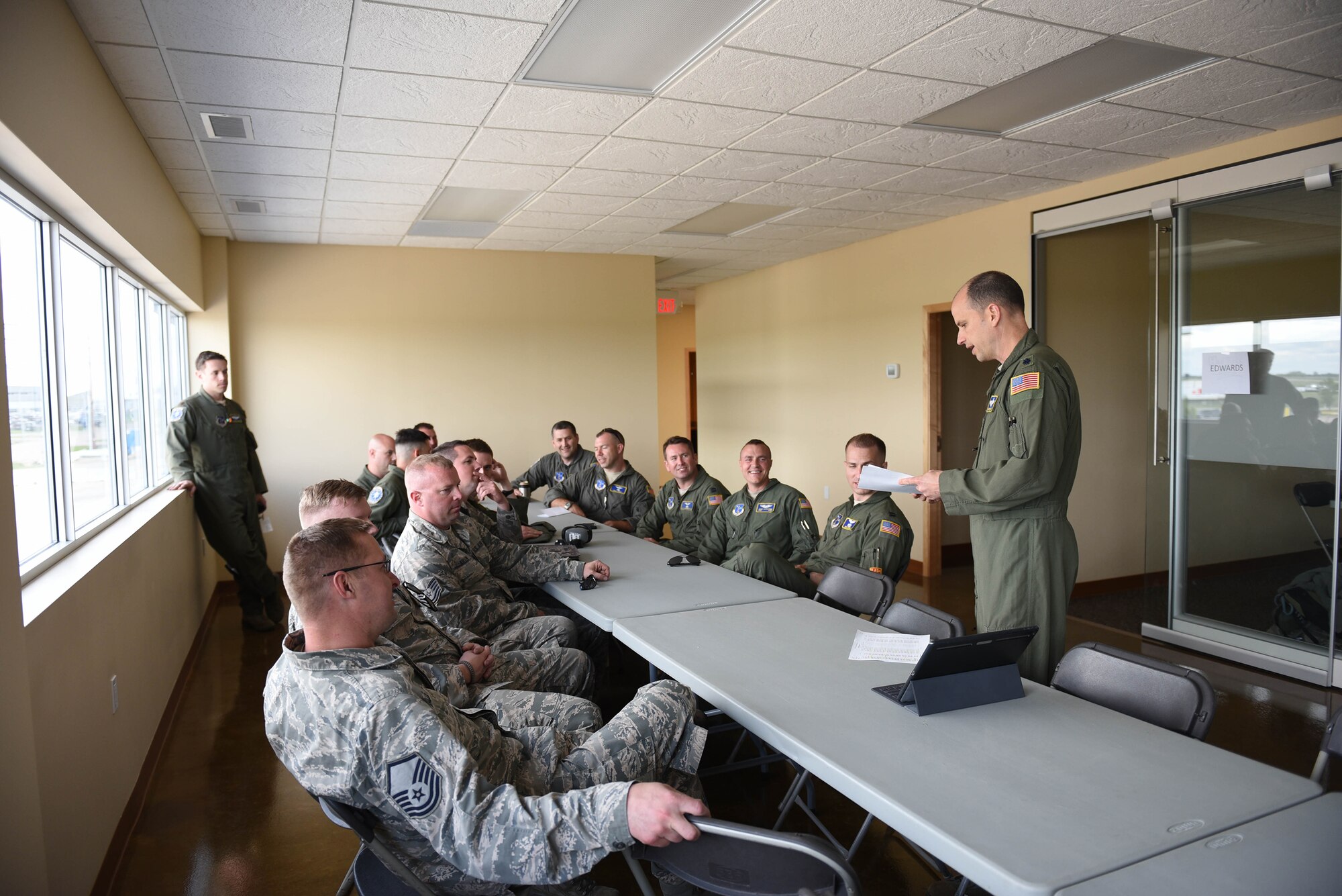Members of the Kentucky Air National Guard’s 165th Airlift Squadron receive a briefing upon arriving in Edmonton, Canada, May 28, 2016. More than 30 Airmen from the Kentucky Air National Guard are currently deployed here to participate in Maple Flag, an aerial combat training exercise involving forces from multiple countries. (U.S. Air National Guard photo by Senior Airman Joshua Horton)