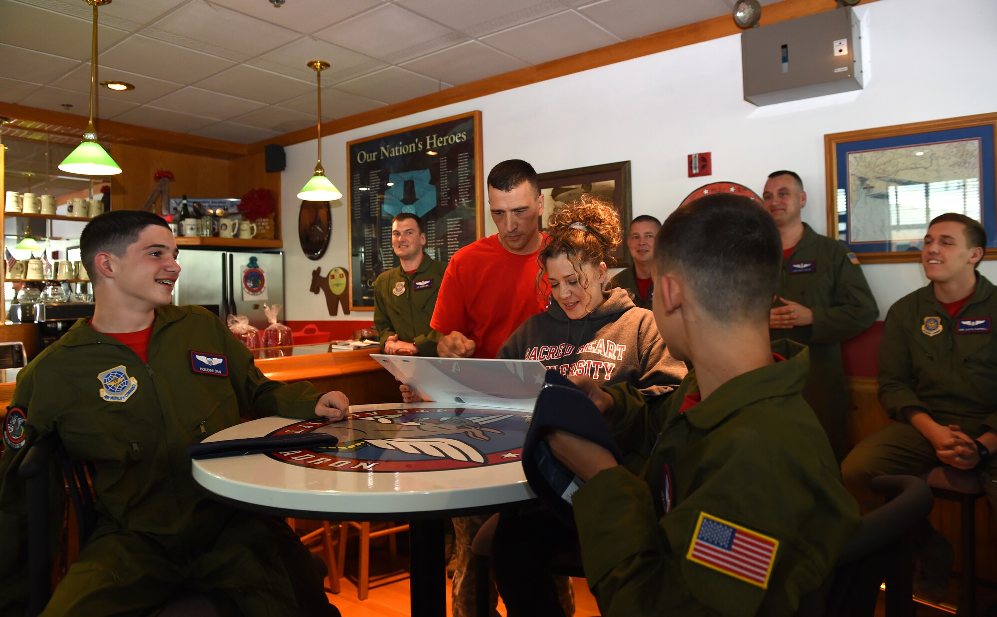 Daniel Duffy (left), and his brother Nicholas Duffy (right) sit with their parents Stephen and Angela Cid in the 4th Airlift Squadron Heritage Room on Joint Base Lewis-McChord, Wash., May 26, 2016. The brothers are the 4th AS’s newest honorary members and spent the entire day experiencing life at McChord. (U.S. Air Force photo/Staff Sgt. Naomi Shipley)