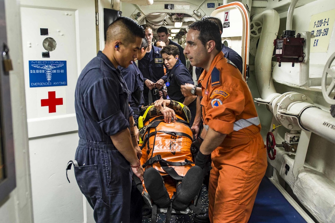 U.S. sailors and a Cyprus navy medic conduct a simulated patient transport during the multinational  search and rescue Exercise Argonaut on the USS Stout in the Mediterranean Sea, May 31, 2016. The guided-missile destroyer is supporting U.S. national security interests in Europe. Navy photo by Petty Officer 3rd Class Bill Dodge