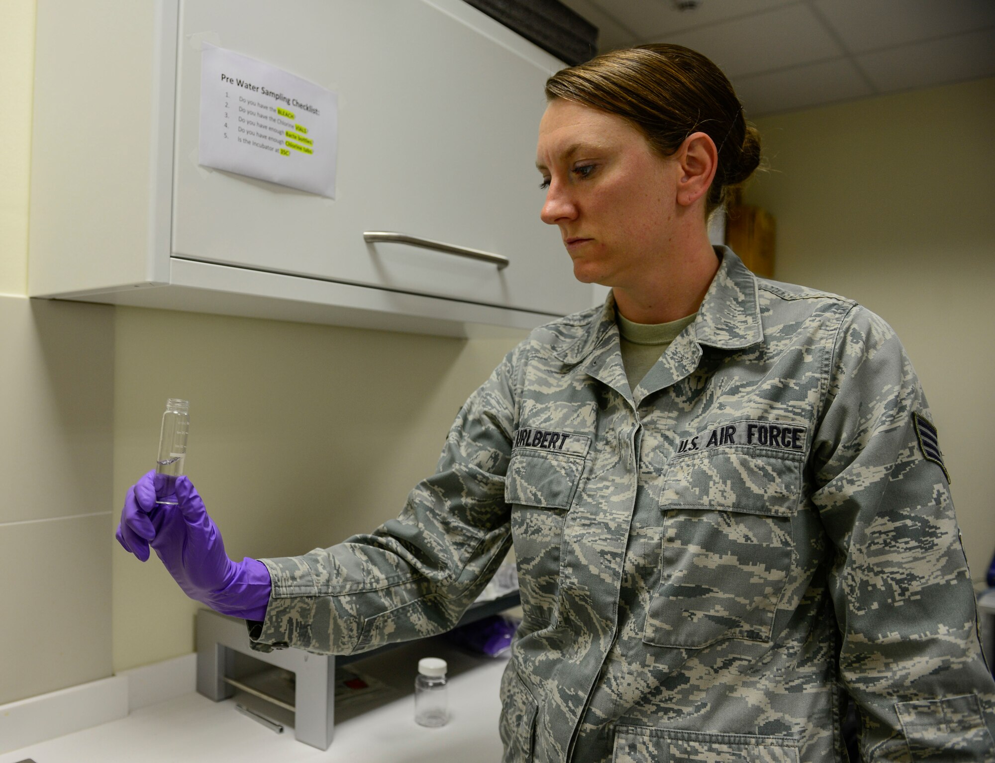 Staff Sgt. Anna Hurlbert, 31st Aerospace Medicine Squadron Environmental Health NCO in charge, prepares to conduct a water sample test June 2, 2016, at Aviano Air Base, Italy. The 31st AMDS recently released the 2015 Drinking Water Consumer Confidence Report which helps inform the public about the drinking water Aviano AB delivers to base personnel every day. (U.S. Air Force photo by Senior Airman Krystal Ardrey/Released) 