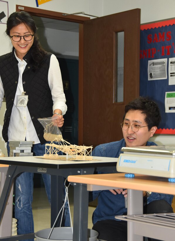 Ka Young Shim, an Architect in Engineering Division’s Design Branch, was recently selected as the Far East District’s “Emerging Leader.” The emerging leader program is a U.S. Army Corps of Engineers initiative geared to develop employees’ leadership skills and future development. Here, Shim works with another FED employee at a STEM event, testing the load-bearing capacity of toothpick bridges designed and built by students at Seoul American Middle School.
