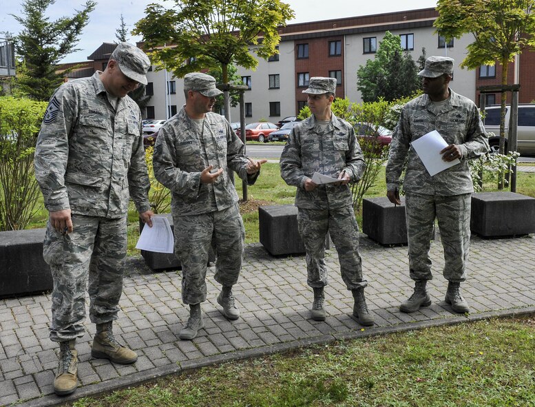 Judges inspect a dorm May 17, 2016, at Ramstein Air Base, Germany. The dorm of the quarter awards are a new incentive that recognize Airmen for their hard work in keeping their living areas clean and encourages them to continue to maintain a high standard of living during their tours here. (U.S. Air Force photo/Senior Airman Larissa Greatwood)