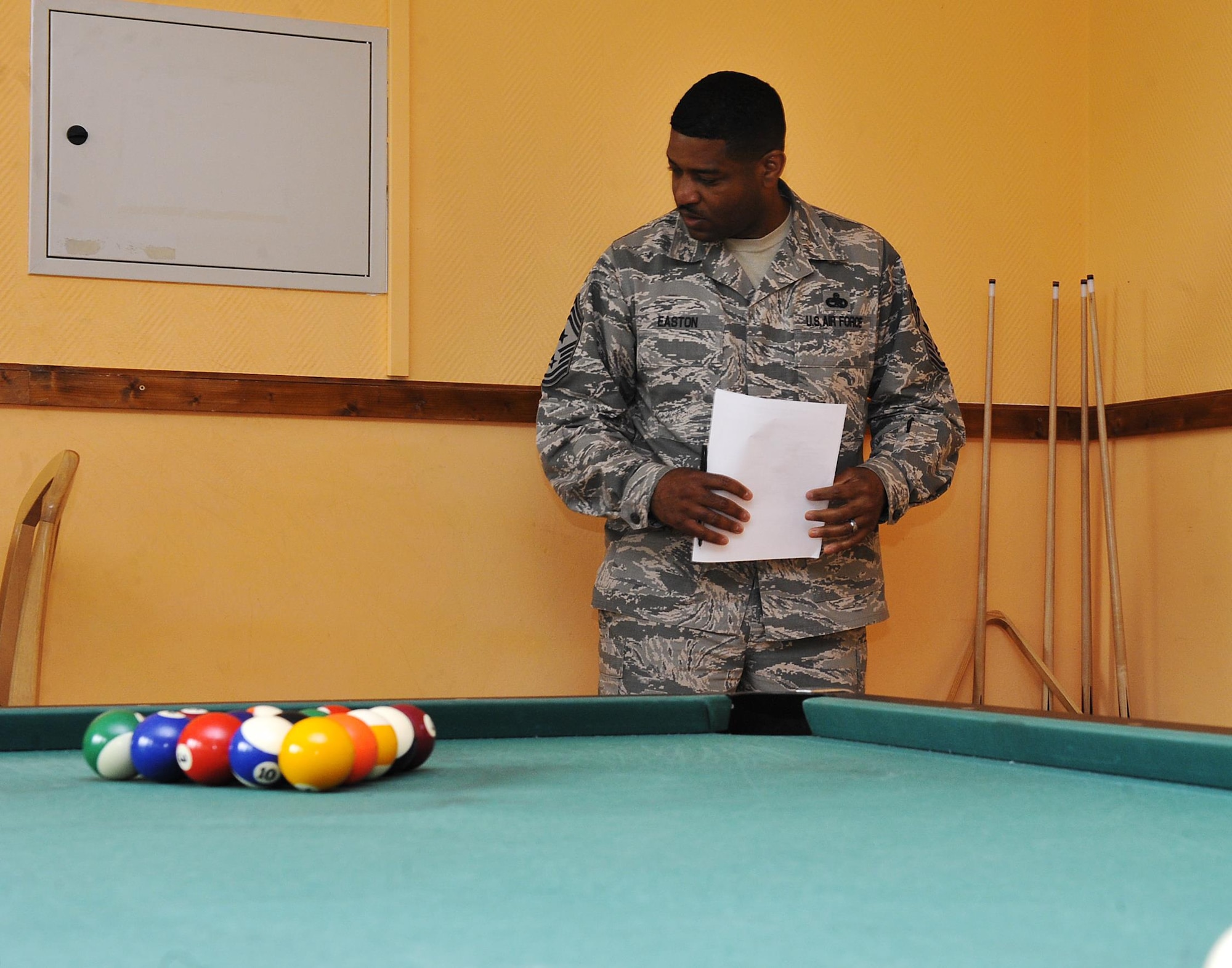 Chief Master Sgt. Phillip Easton, 86th Airlift Wing command chief, inspects a dayroom May 17, 2016, at Ramstein Air Base, Germany. The dorm of the quarter awards are a new incentive that recognize Airmen for their hard work in keeping their living areas clean and encourage them to continue to maintain a high standard of living during their tours here. This quarter’s winning dorm was building 2119, and second place was building 2418. (U.S. Air Force photo/Senior Airman Larissa Greatwood)