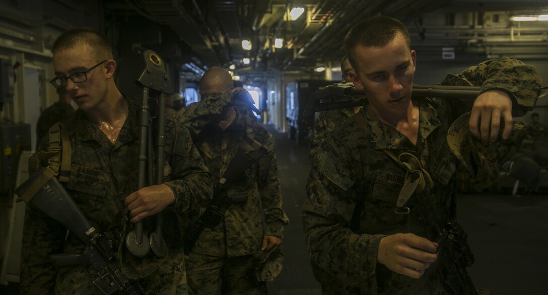 Lance Cpl. Abraham U. Aaron (Left) and Lance Cpl. Noah A. Bigbee (Right) obtain their room keys and check in weapons as part of checking in on USNS Sacagawea (T-AKE 2) with Task Force Koa Moana on May 27, 2016 in Darwin, Australia. The task force is scheduled to participate in multiple exercises with countries such as Fiji, Tonga, Papua New Guinea and Timor Leste to improve interoperability and relations. Aaron, from Grand Ronde, Oregon, is an infantryman originally assigned to Bravo Company, 1st Battalion, 1st Marine Regiment, 1st Marine Division, I Marine Expeditionary Force. Bigbee, from Farmington, Minnesota, is an infantryman originally assigned to Weapons Company, 1st Battalion, 1st Marines, 1st MarDiv, I MEF. Both Marines are now assigned to Task Force Koa Moana for the deployment. (U.S. Marine Corps photo by Cpl. William Hester/ Released)