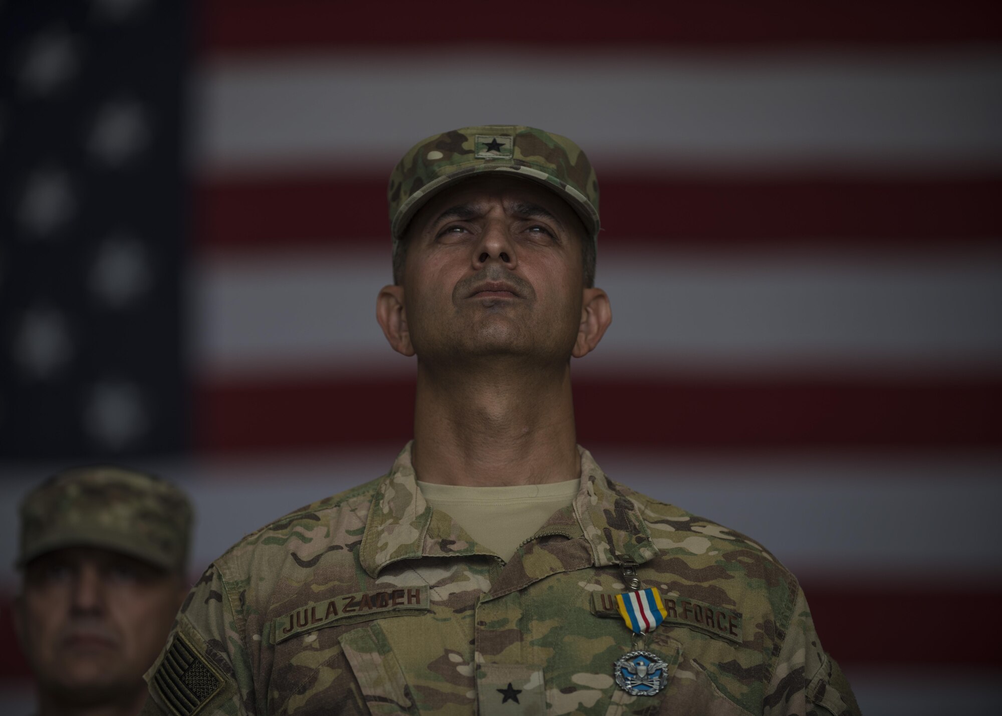 Brig. Gen. David Julazadeh, 455th Air Expeditionary Wing commander, stands at attention during a change of command ceremony at Bagram Airfield, Afghanistan, June 03, 2016. Julazadeh has held the 455th AEW's command position for the past year and will now be headed to MacDill Air Force Base, Florida as deputy director, operations, J3, U.S. Central Command. (U.S. Air Force photo by Senior Airman Justyn M. Freeman)