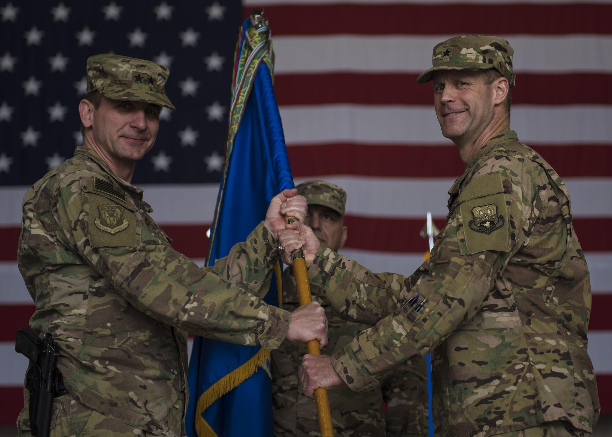 Maj. Gen. Geffrey Taliaferro (left), 9th Air and Space Expeditionary Task Force-Afghanistan commander, grants command to Brig. Gen. James Sears, 455th Air Expeditionary Wing commander, during a change of command ceremony at Bagram Airfield, Afghanistan, June 03, 2016. Sears comes to the 455th AEW from the Headquarters Air Force Personnel Center, Joint Base San Antonio-Randolph, Texas where he serves as Director of Assignments and Air and Space Expeditionary Force Operations. (U.S. Air Force photo by Senior Airman Justyn M. Freeman)
