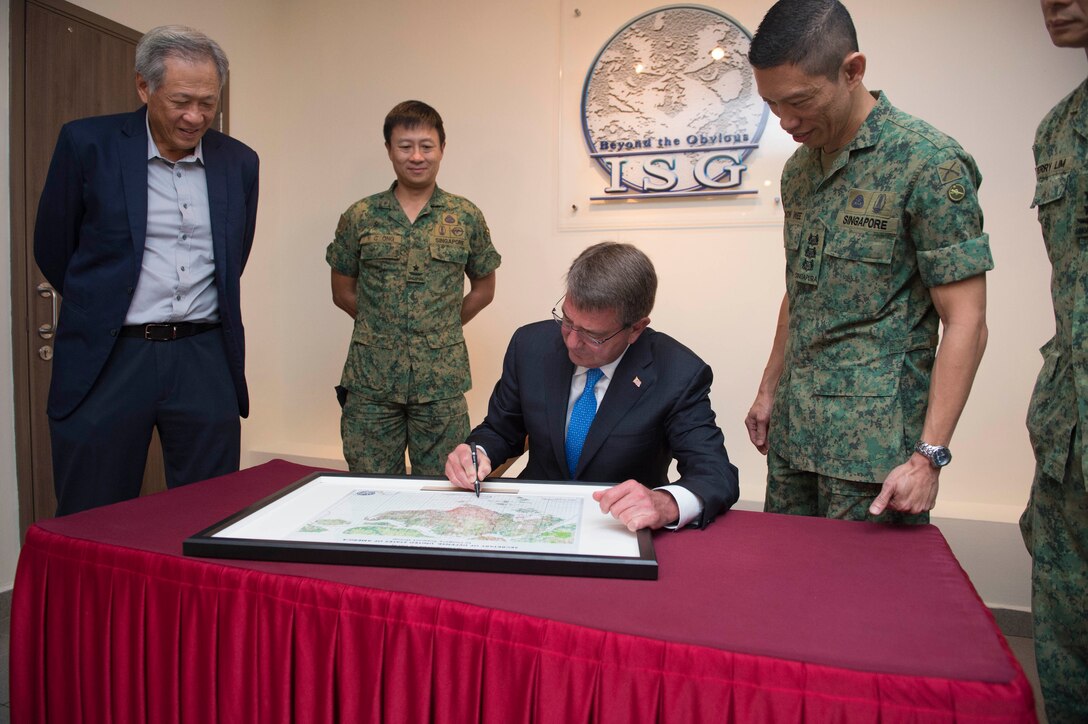 Defense Secretary Ash Carter signs the guest book at the Imagery Support Group in Singapore, June 3, 2016.  DoD photo by Navy Petty Officer 1st Class Tim D. Godbee