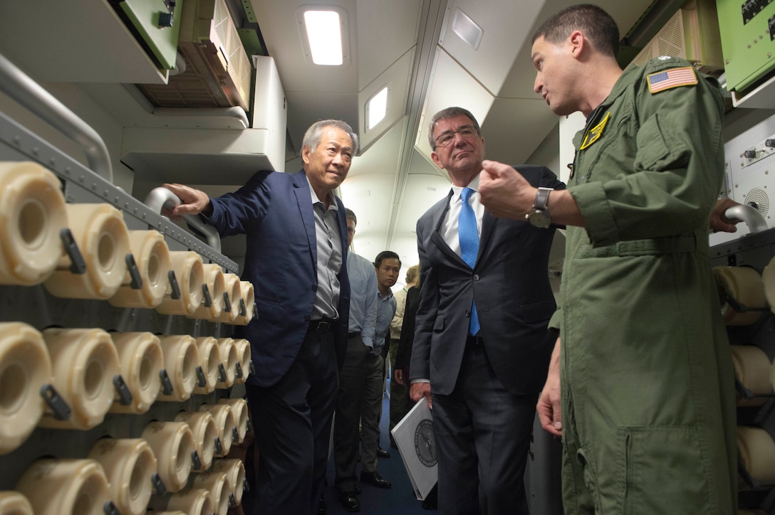 Defense Secretary Ash Carter and Singaporean Defense Minister Ng Eng Henon receive a briefing on the capabilities of a P-8 during a flight over Singapore and the Strait of Malacca, June 3, 2016. DoD photo by Navy Petty Officer 1st Class Tim D. Godbee