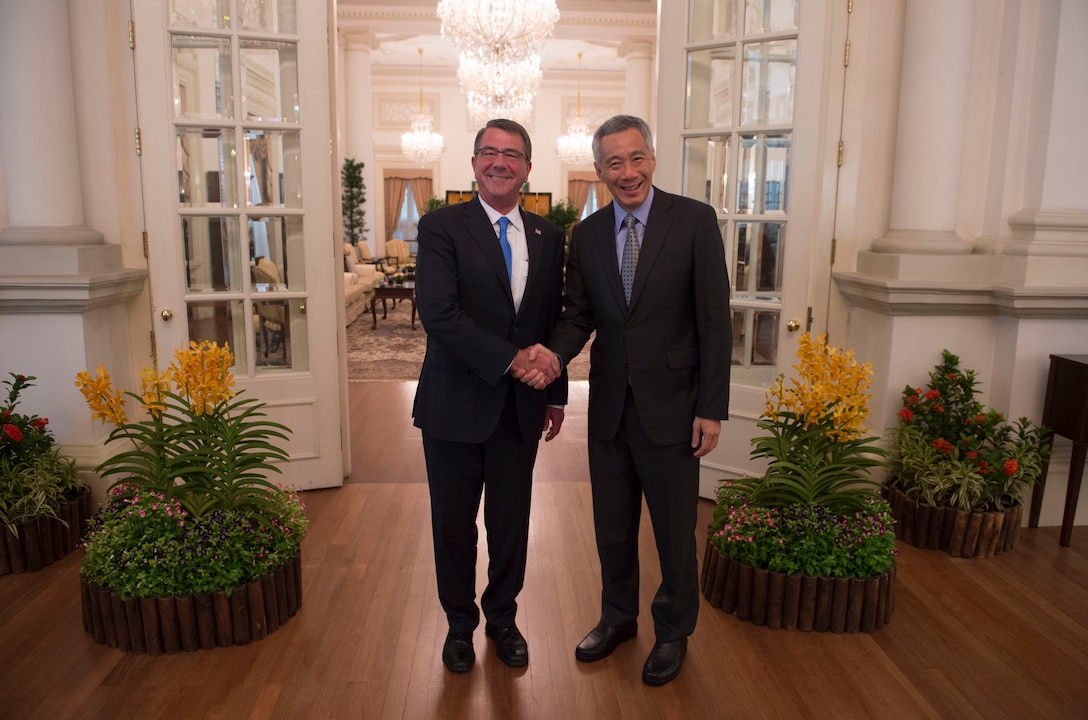 Defense Secretary Ash Carter, left, greets Singaporean Prime Minister Lee Hsien Loong in Singapore, June 3, 2016. DoD photo by Navy Petty Officer 1st Class Tim D. Godbee