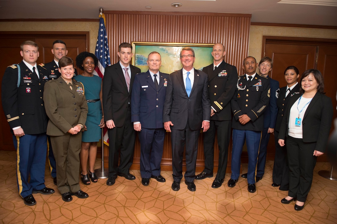 Defense Secretary Ash Carter, center, poses with service members and civilians assigned to the U.S. embassy in Singapore, June 3, 2016. DoD photo by Navy Petty Officer 1st Class Tim D. Godbee