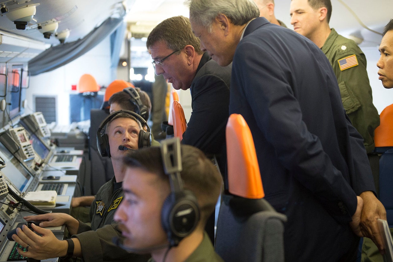 Defense Secretary Ash Carter and Singaporean Defense Minister Ng Eng Hen are briefed on the capabilities of a P-8 during a flight over Singapore and the Strait of Malacca, June 3, 2016. Carter is in Singapore attending the Shangri-La Dialogue. DoD photo by Navy Petty Officer 1st Class Tim D. Godbee