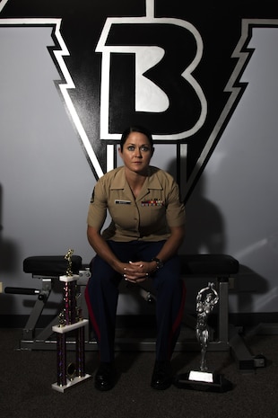 Staff Sgt. Annemarie E. Baker poses for a photo in the gym where she trained to win her first bodybuilding competition. Baker, a 14-year Marine and mother, attributed her decision to compete to her military career.