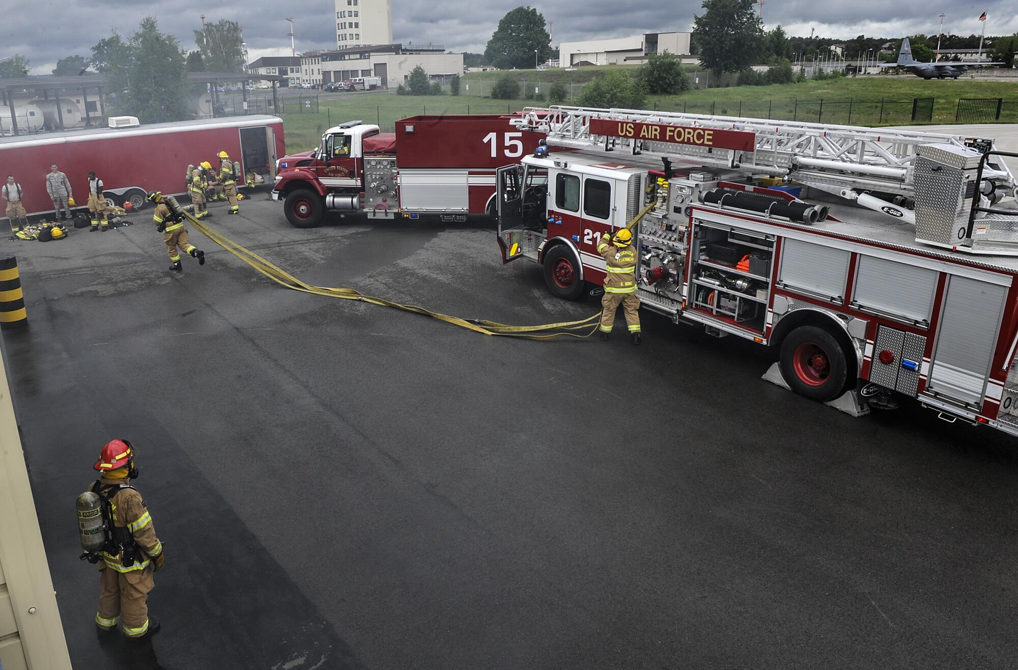 Airmen from the 86th Civil Engineer Squadron participate in a biannual-training exercise June 2, 2016, at Ramstein Air Base, Germany. The 86th CES Airmen provide fire emergency services to Ramstein Air Base, Vogelweh Military Complex, Rhine Ordinance Barracks and Landstuhl military sites. (U.S. Air Force photo/Senior Airman Larissa Greatwood)