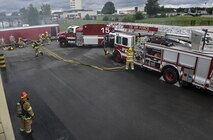 Airmen from the 86th Civil Engineer Squadron participate in a biannual-training exercise June 2, 2016, at Ramstein Air Base, Germany. The 86th CES Airmen provide fire emergency services to Ramstein Air Base, Vogelweh Military Complex, Rhine Ordinance Barracks and Landstuhl military sites. (U.S. Air Force photo/Senior Airman Larissa Greatwood)