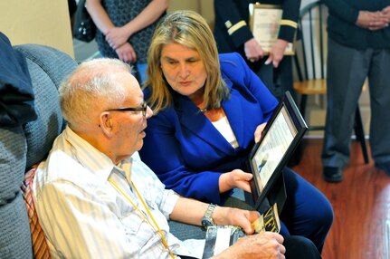 San Jose Vice Mayor Rose Herrera presents a certificate to Merle House, an 87 year old Navy Veteran, as part of a surprise ceremony made possible by the Dream Foundation, an organization that grants wishes for terminally ill patients, June 1, at a Veterans Affairs sponsored foster care facility in San Jose, Calif.

House is in the final stages of Parkinson’s disease and had made a request to the Dream Foundation to be reunited one last time with a close female friend in Palos Verdes, Calif., which was granted by the foundation. The presentation of the ‘wish basket’, which contained the travel arrangements for his upcoming trip, was facilitated by the Santa Clara VA.