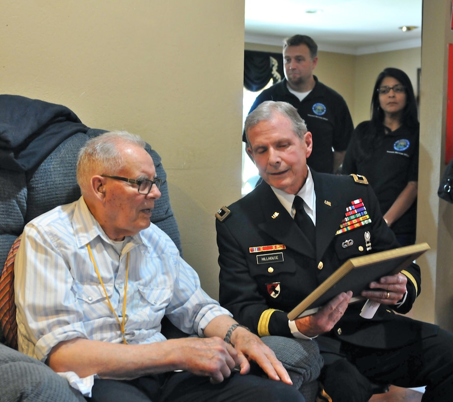 Retired Maj. Gen. Kent Hillhouse presents a Certificate of Appreciation to Navy veteran Merle House, as part of a surprise ceremony made possible by the Dream Foundation, an organization that grants wishes for terminally ill patients, June 1, at a Veterans Affairs sponsored foster care facility in San Jose, Calif.

House, 87, is in the final stages of Parkinson’s disease and had made a request to the Dream Foundation to be reunited one last time with a close female friend in Palos Verdes, Calif., which was granted by the foundation. The presentation of the ‘wish basket’, which contained the travel arrangements for his upcoming trip, was facilitated by the Santa Clara VA.