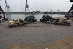 Soldiers of the 66th Transportation Company upload 10-ton forklifts at the Szczecin port for delivery to Zagan Training Area May 20. From here, the forklifts are line-hauled to various raining areas within Poland.