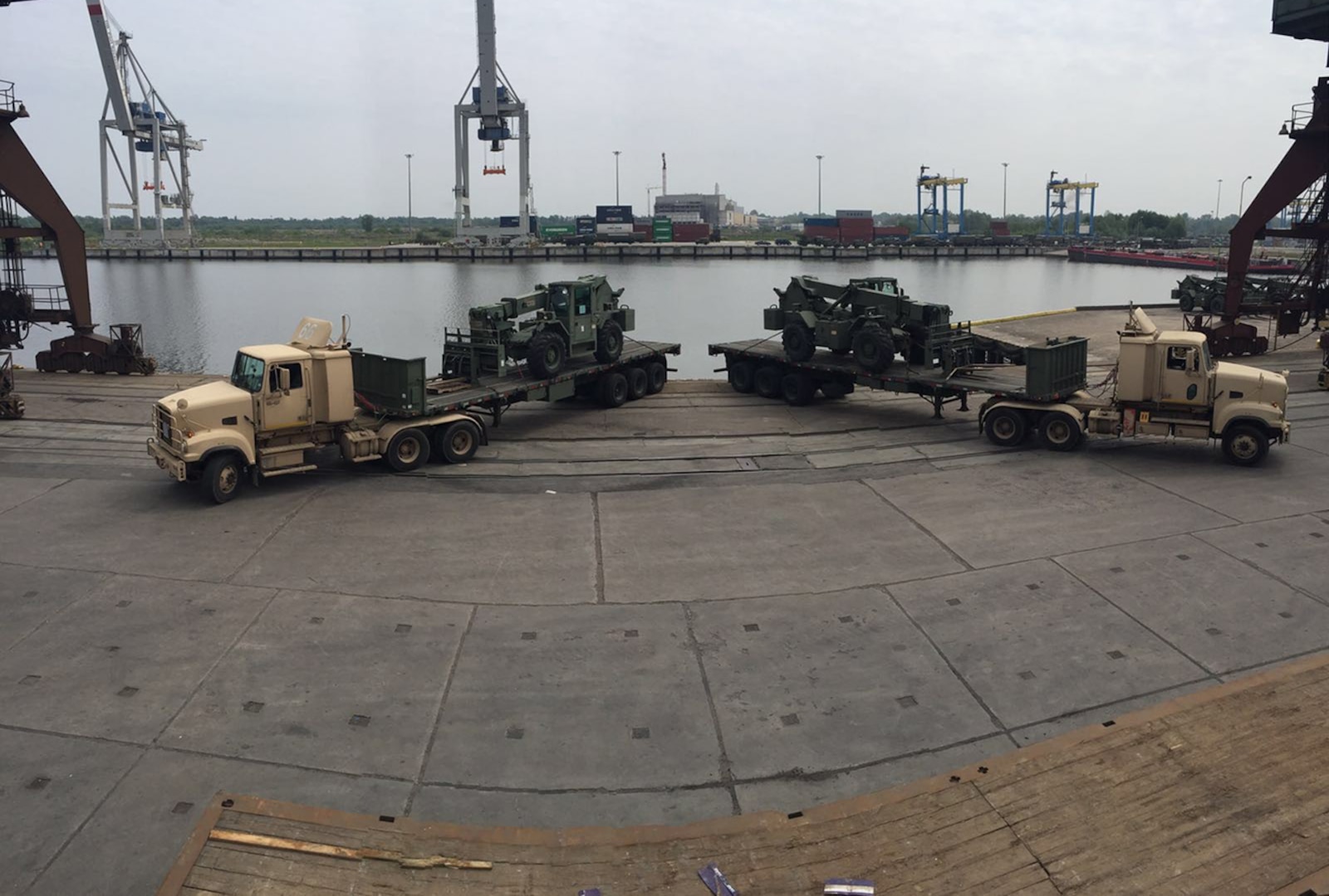 Soldiers of the 66th Transportation Company upload 10-ton forklifts at the Szczecin port for delivery to Zagan Training Area May 20. From here, the forklifts are line-hauled to various raining areas within Poland.