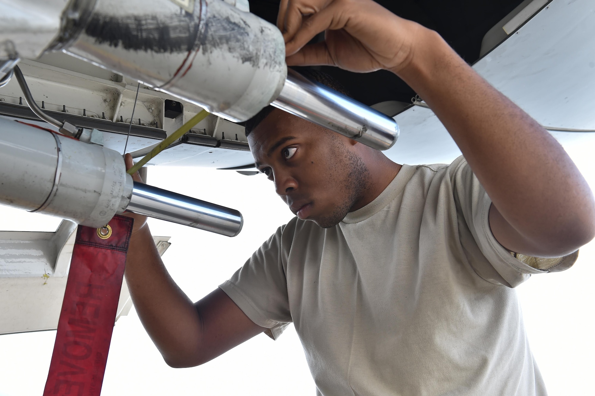 Airman 1st Class Billy Crocket, a 437th Aircraft Maintenance Squadron aerospace maintenance journeyman, performs preflight inspections on landing gear on a C-17 Globemaster III during Crescent Reach 16 at Joint Base Charleston, S.C., May 24, 2016. Crescent Reach is an annual exercise designed to test and evaluate Joint Base Charleston's ability to mobilize and launch a large aircraft formation in addition to training, processing and deploying Airmen and cargo in response to a simulated crisis abroad. (U.S. Air Force photo/Senior Airman Logan Carlson)