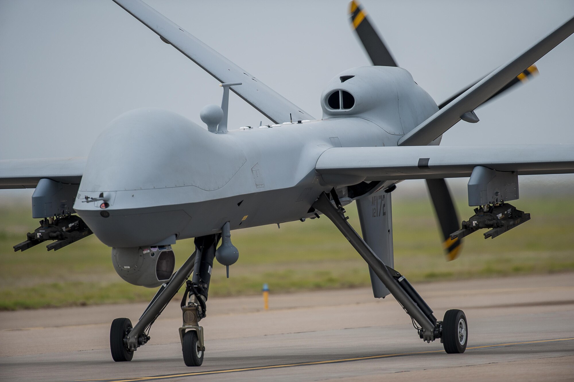 An MQ-9 Reaper performs a low pass during an air show demonstration May 29, 2016, at Cannon Air Force Base, N.M. The air show highlights the unique capabilities and qualities of Cannon's air commandos and also celebrates the long-standing relationship between the 27th Special Operations Wing and the local community.  (U.S. Air Force photo/Master Sgt. Dennis J. Henry Jr.)