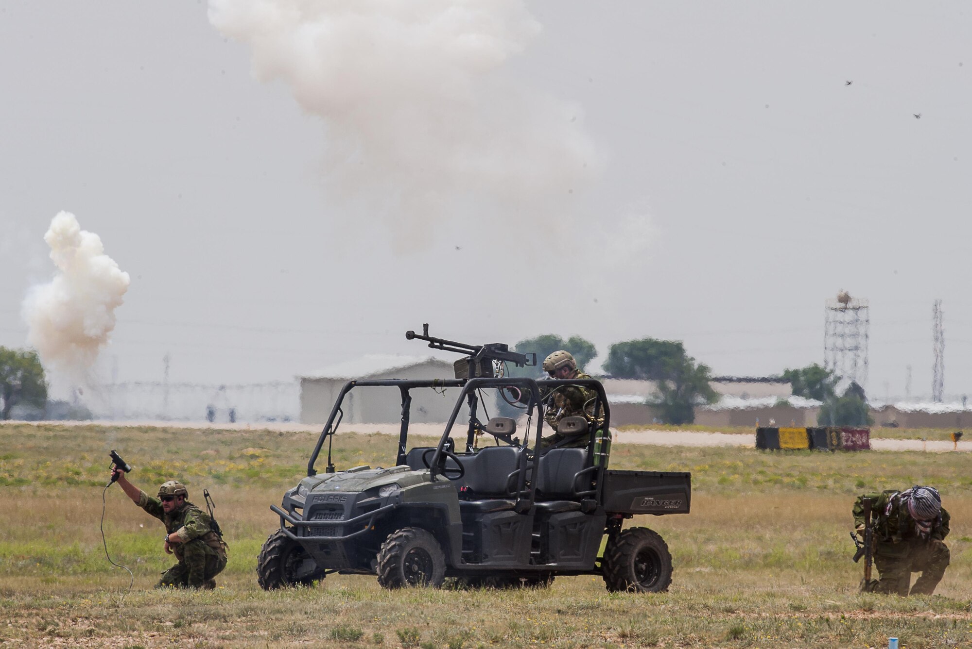 Members of the 27th Special Operations Security Forces Squadron participate in a capabilities demonstration during the Cannon Air Show on May 29, 2016, at Cannon Air Force Base, N.M. The 2016 Cannon Air Show highlights the unique capabilities and qualities of Cannon's air commandos and also celebrates the long-standing relationship between the 27th Special Operations Wing and the local community.  (U.S. Air Force photo/Master Sgt. Dennis J. Henry Jr.)