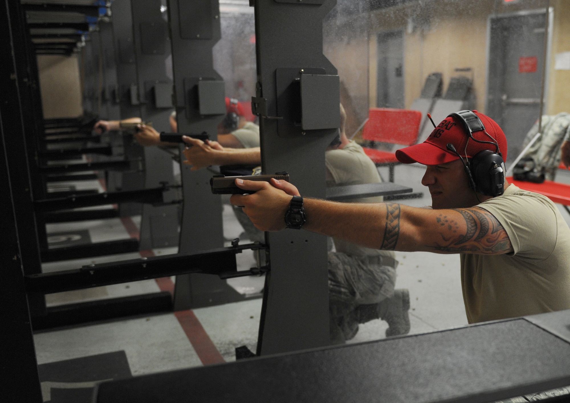 Staff Sgt. Jeffrey Tuscany, an 81st Security Forces Squadron combat arms instructor, fires his weapon during the 81st SFS Law Enforcement Team Competition May 18, 2016, at Keesler Air Force Base, Miss. The competition was held during National Police Week, which recognizes the service of law enforcement men and women who put their lives at risk every day. (U.S. Air Force photo/Kemberly Groue)