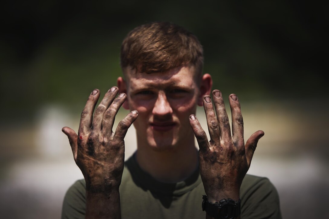 Lance Cpl. Christopher Clark poses after fixing a Humvee, May 28, 2016, at Camp Rodriguez Live Fire Complex, South Korea. Clark is an engineer equipment electrical systems technician and is in charge of the repair of vehicles during Korea Explosive Ordnance Disposal Exercise. Clark is from Meadowview, Va., and is attached to Support Company, 9th Engineer Support Battalion, 3rd Marine Logistics Group, III Marine Expeditionary Force. (U.S. Marine Corps photo by Cpl. Isaac Ibarra/Released)