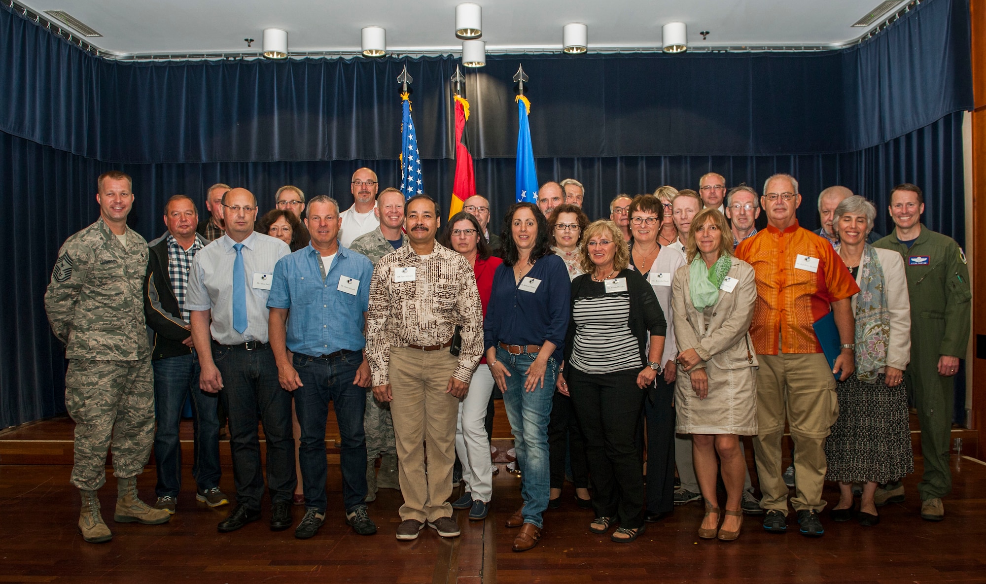 Civilian employees of the 52nd Fighter Wing pose with wing leaders after the Length of Service recognition ceremony in Club Eifel at Spangdahlem Air Base, Germany, June 3, 2016. Thirty-one members of the civilian work force earned recognitionbased on decades of service to the Spangdahlem community. (U.S. Air Force photo by Airman 1st Class Timothy Kim/Released)