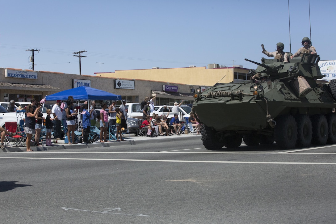 Marines with 3rd Light Armored Reconnaissance Battalion wave to parade spectators during the annual Grubstake Days Parade in Yucca Valley, Calif., May 28, 2016. The parade was held as part of Yucca Valley’s Annual Grubstake Days, a festival held to embrace the mining heritage of the Yucca Valley community. (Official Marine Corps photo by Cpl. Medina Ayala-Lo/Released)